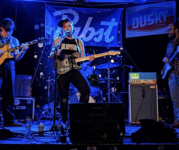 A band performs on stage at the pinhook.