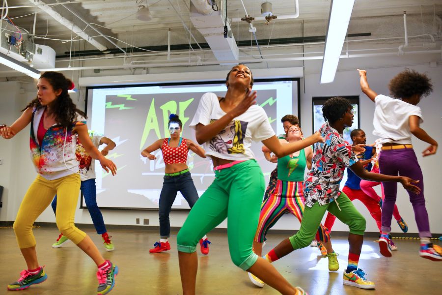 Performers dance on stage at The American Dance Festival