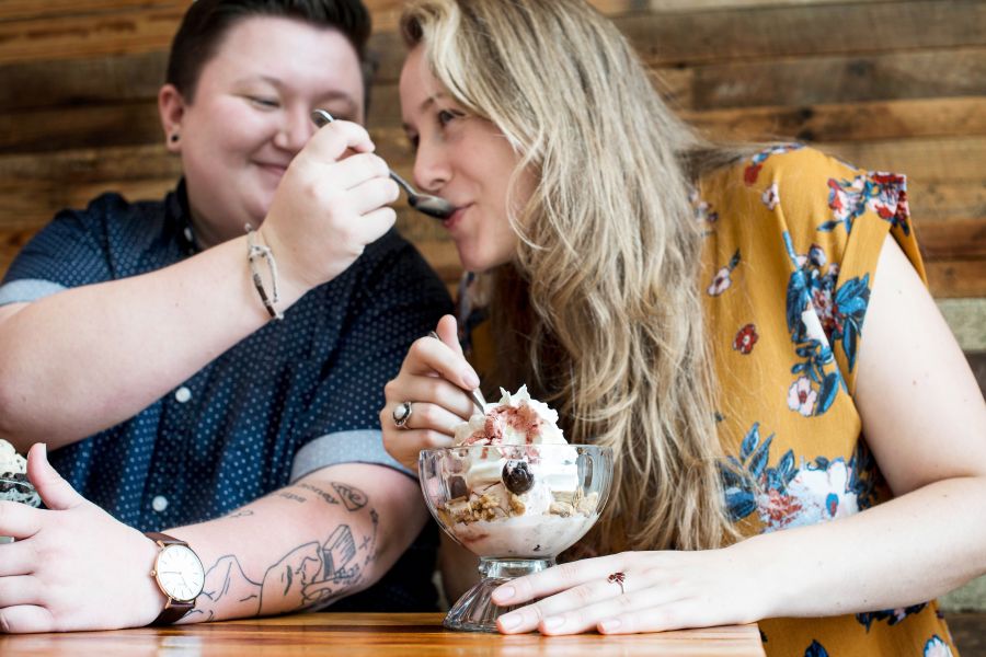 A couple share a sundae at The Parlour in downtown Durham, NC.