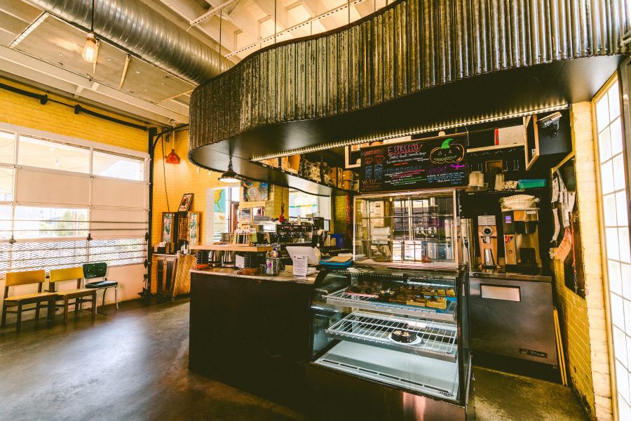 Warm lighting illuminates the front counter at Cocoa Cinnamons Geer Street location.