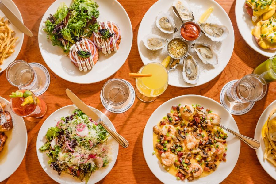 A generous spread of fine food from Alley Twenty Six sits on a table.