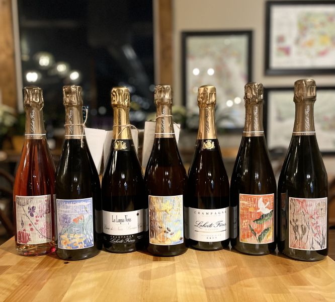 A row of wine bottles sit on the counter at LouElla in Durham, NC.