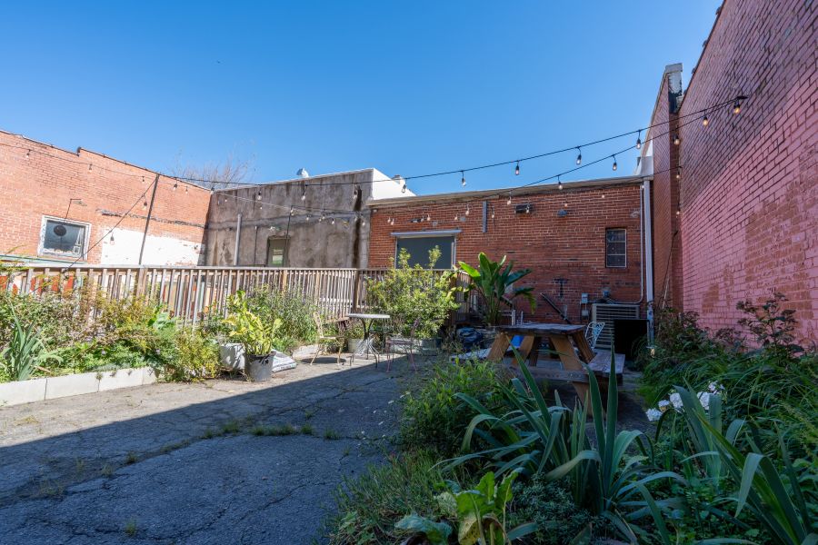 A clear sky hangs over the patio at Perfect Lovers in Durham, NC.