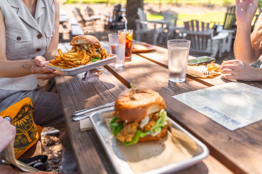 People dine outside at Lakewood Social, located in the Lakewood/Rockwood district.