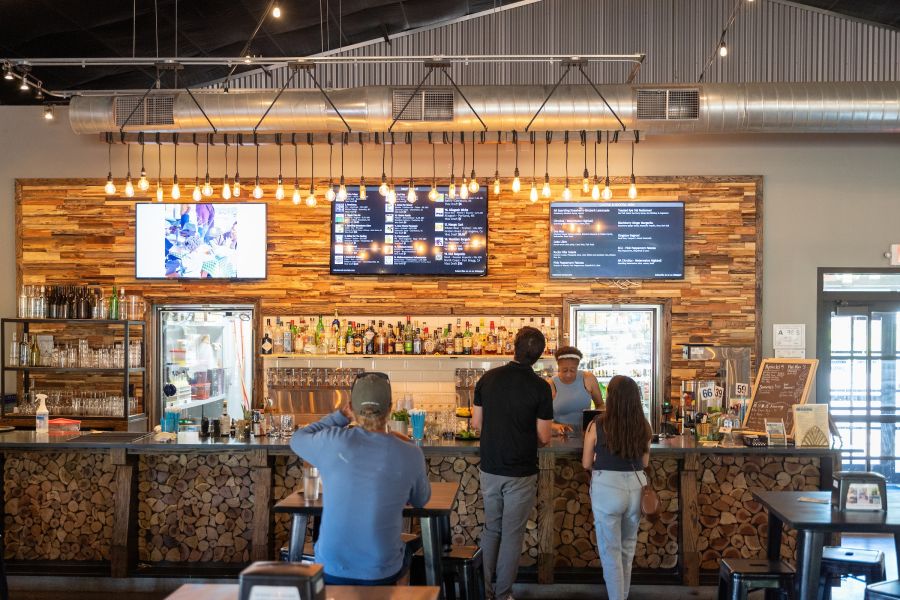 People order at the bar inside Lakewood Social, located in the Lakewood/Rockwood district.