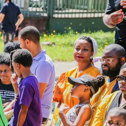 Onlookers watch a Juneteenth processional in Durham.