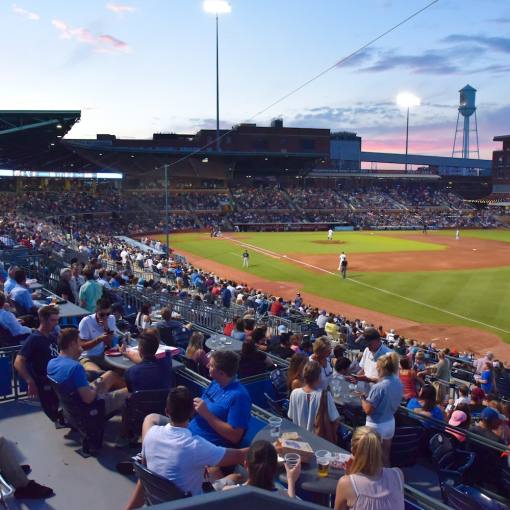 Fans pack the stands at sunset in the Durham Bulls Athletic Park.
