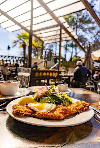 Sun shines on a traditional German breakfast of schnitzel on the patio at Guglhupf.