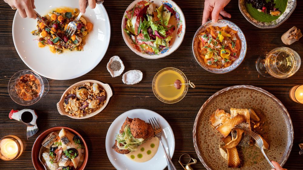 Diners dig into a delicious looking spread at Littler in Durham, NC