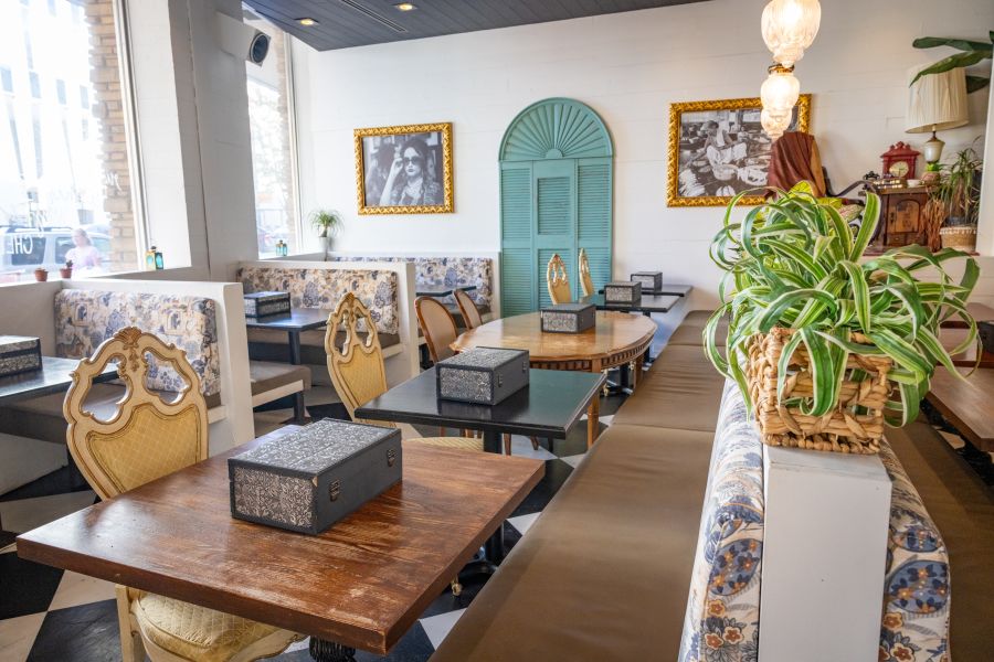 The dining area at Cheeni bathes in sunlight, waiting for customers to sit.