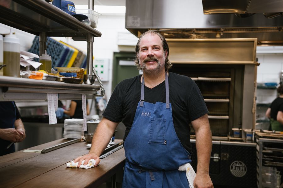 Chef Matt Kelly stands in the kitchen at Nana's.