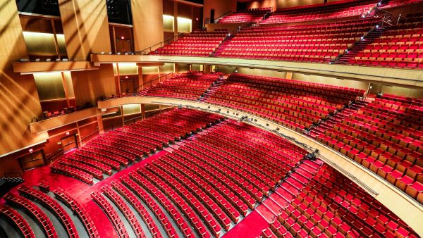 A wide-angle view displays the large amount of comfortable seating in the Durham Performing Arts Center.