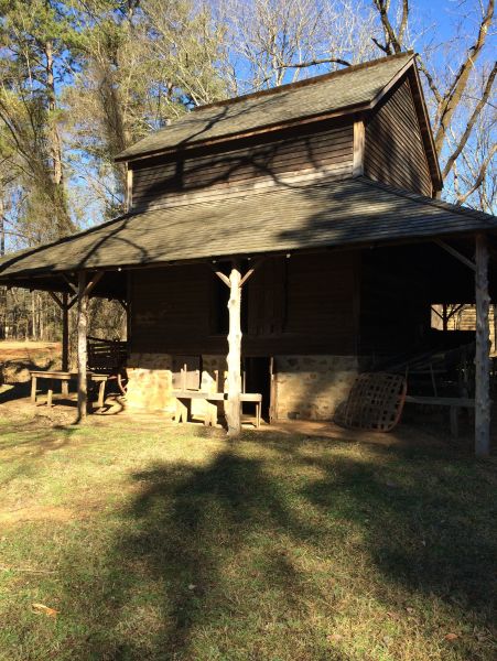 An old, preserved building sits on the grounds of Duke Homestead in Durham.