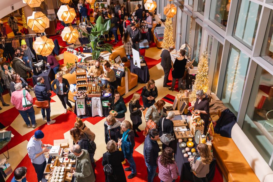 Shoppers peruse locally made wares at the holiday market at The Durham Hotel.
