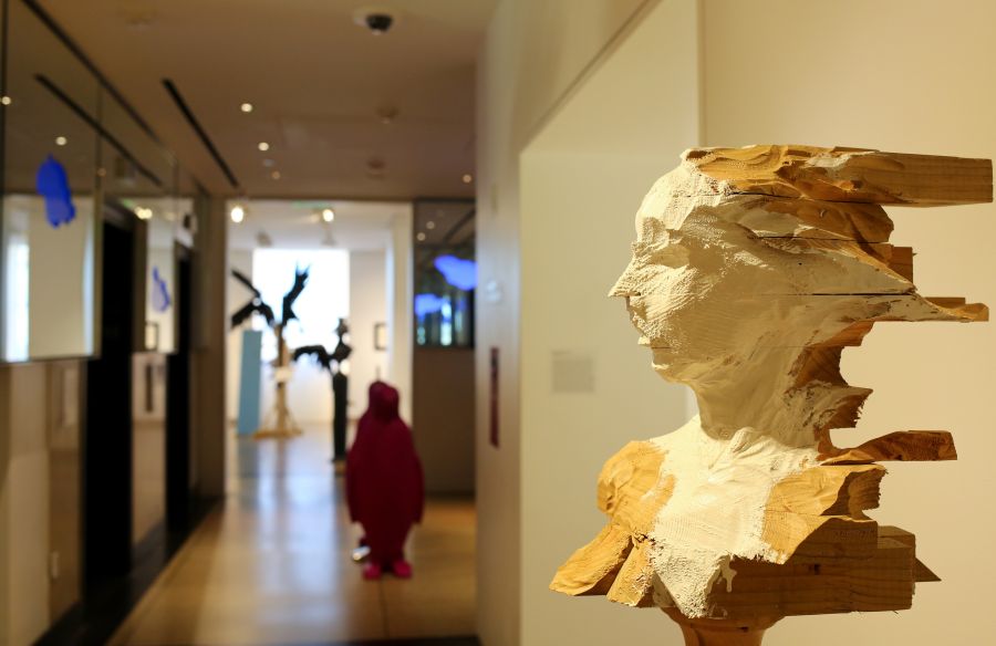 A statue foregrounds a still from the 21c Museum Hotel in Durham.