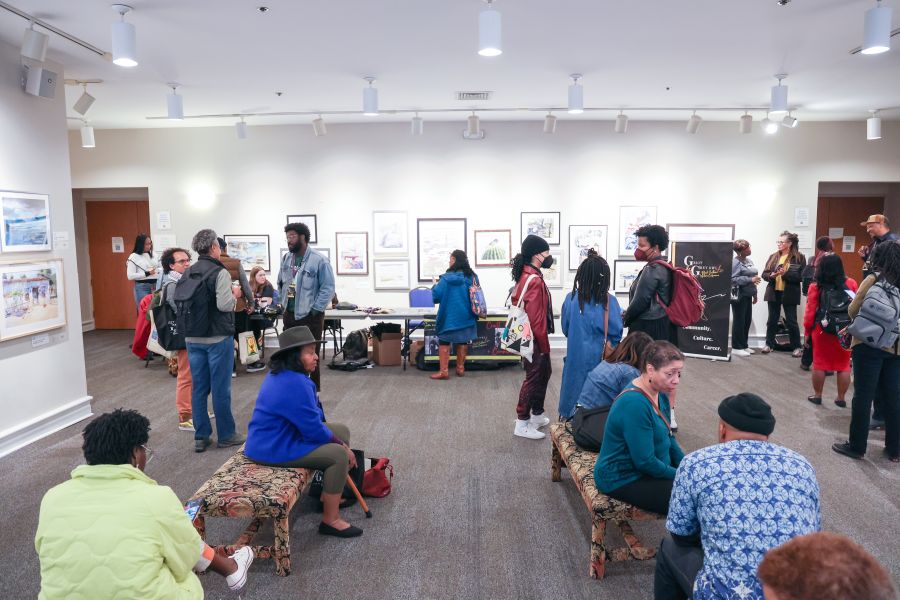 Conference goers sit and converse at Griot and Grey Owl.