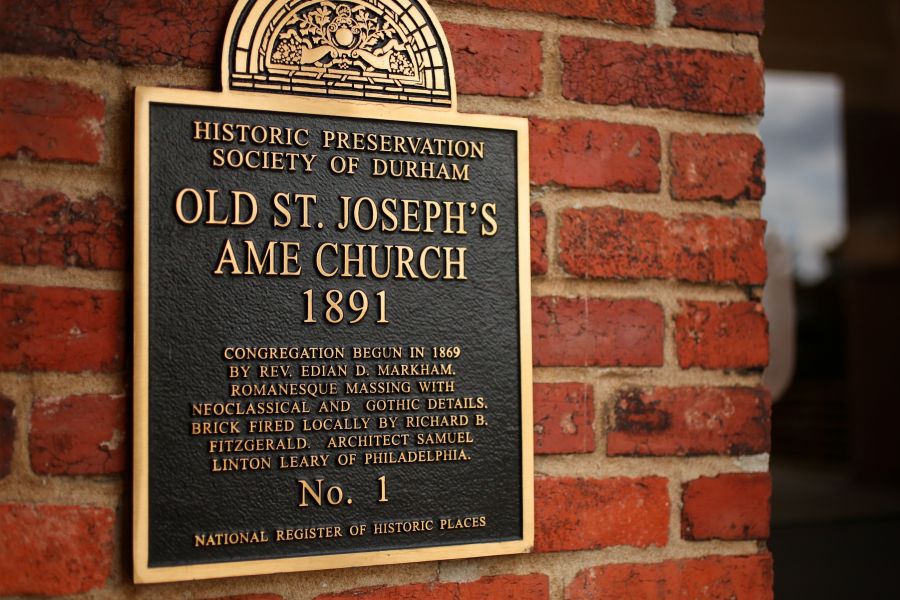 A plaque tells the history of Old St. Joseph's AME Church in Durham.