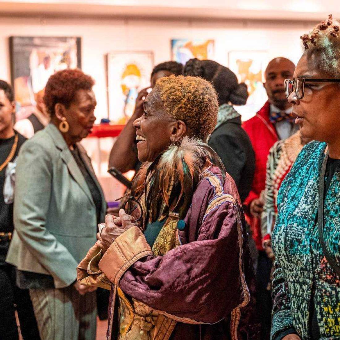 A crowd socializes in the Hayti Heritage Center lobby before the Hayti Heritage Film Festival starts.