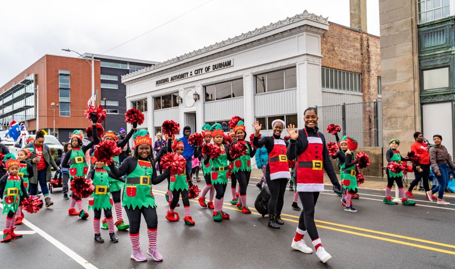 The community comes together in downtown Durham at the annual holiday parade.