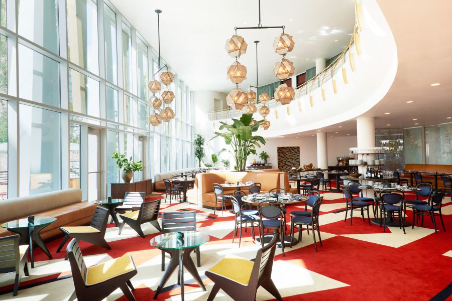 The open seating arrangement of The Durham Hotel's cafe makes the most of the natural light filtering through the windows.