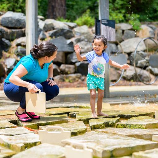A parent and child play at the Earth Moves exhibit at the Museum of Life and Science in Durham, NC.