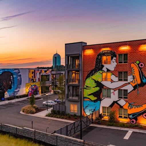 A sunburst sky stands above the murals at U Hill Walls.