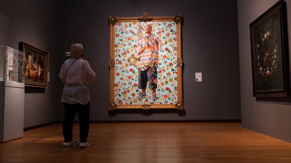 A guest views St. John the Baptist II, by Kehinde Wiley at The Nasher Museum of Art.