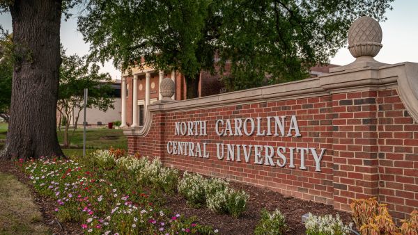 Plants surround the main sign on North Carolina Central University&#039;s campus.