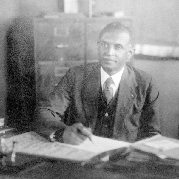 A black and white photo depicts the founder of North Carolina Central University, James E. Shepard.
