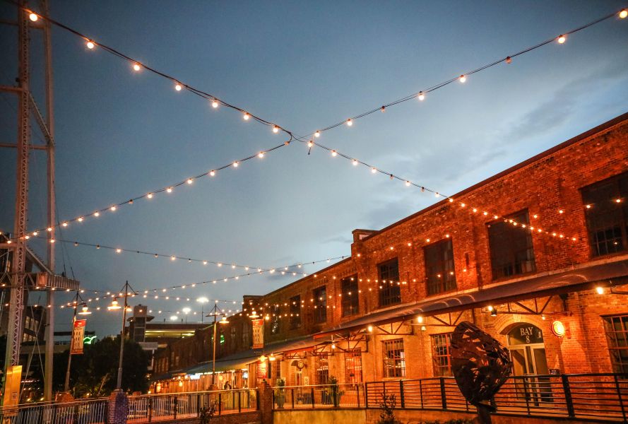 String lights hang over the American Tobacco Campus in Durham.