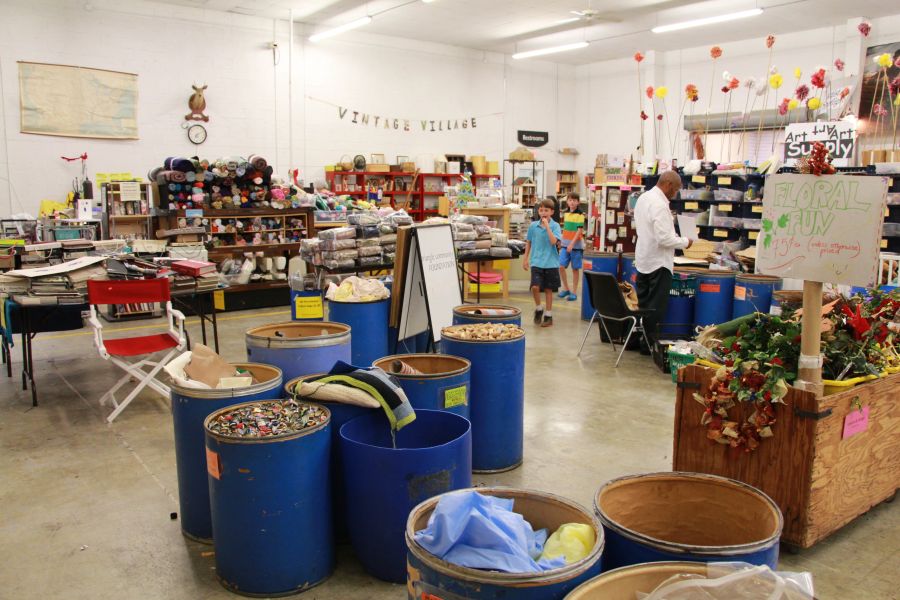 Customers sift through the bins at the vintage village area at Scrap Exchange in Durham, NC.