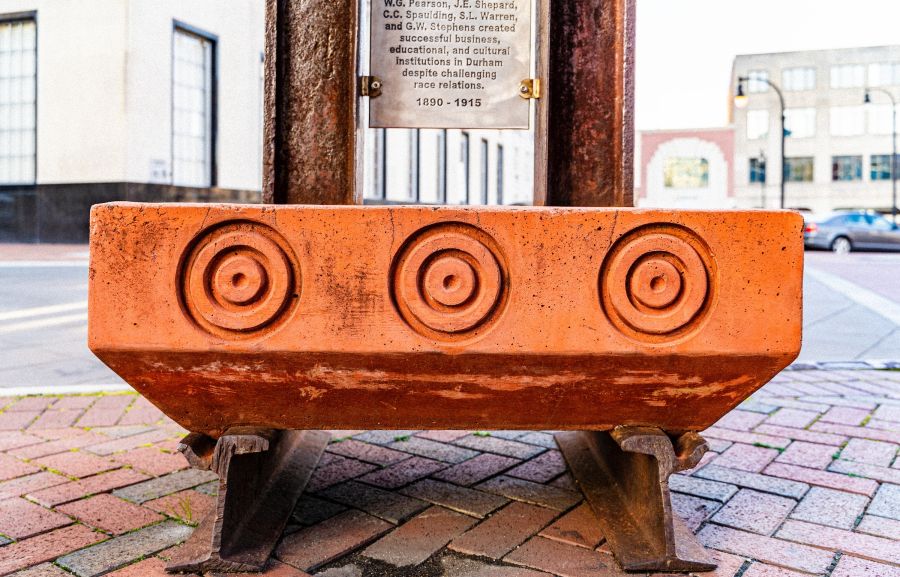 Detail of a sculpture commemorating Durham's heritage as the home to a vibrant Black Wall Street (present-day Parrish Street)