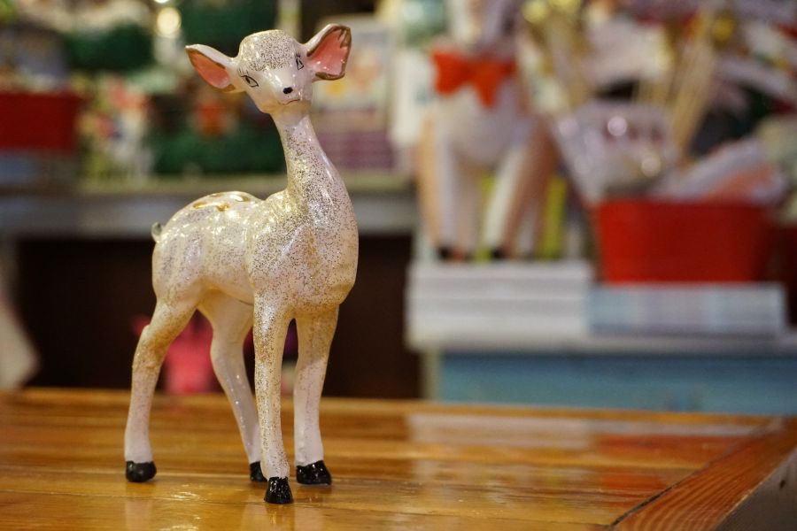 A lamp figurine sits cutely on a table at Parker and Otis at the American Tobacco Campus.