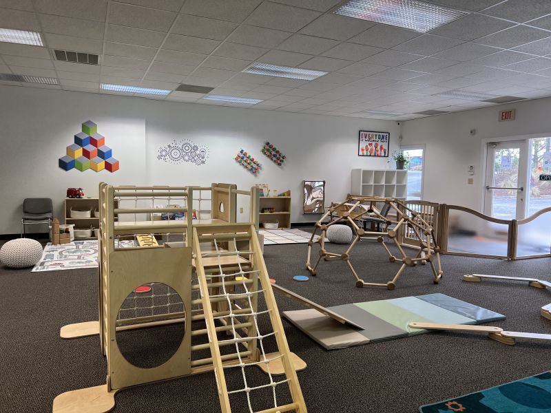 Play sets sit in a play space, waiting for children to enjoy them at The Wonder Lab in Durham, NC.
